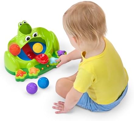 Infant interactive toy showing a close-up of the built-in trampoline mechanism and colorful buttons on the frog's feet.
