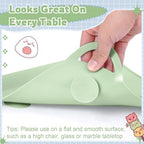 Detailed view of the raised teething edge bumper on the green silicone placemat designed for soothing infant gums.