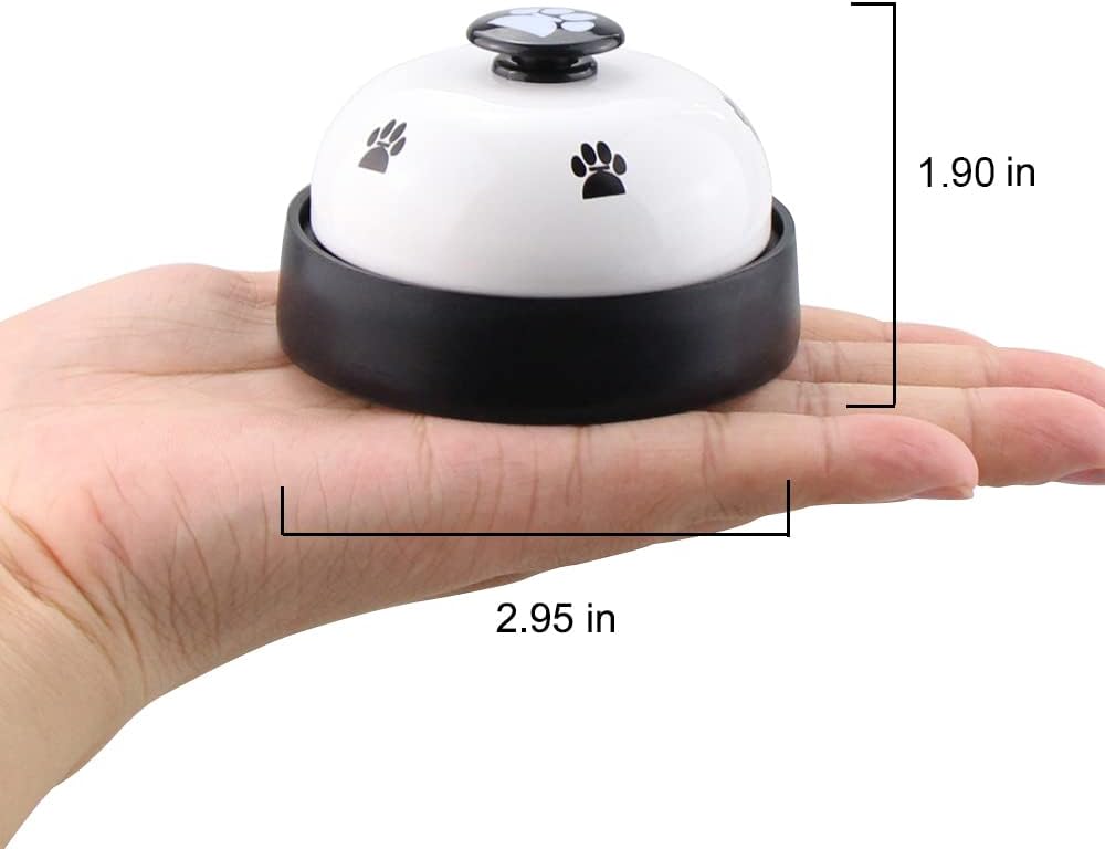 Dog pressing potty training bell with paw