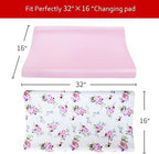 Pink and floral patterned nursery bedding sheets laid flat