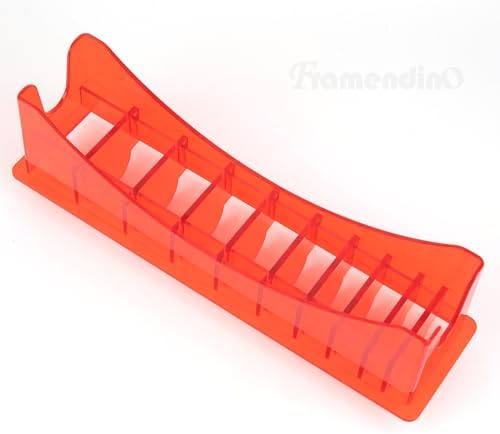 Framendino red plastic barber tools organizer box resting on a workstation salon setup