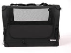 Thule black collapsible dog crate close up of the durable carrying handles and zipper track.
