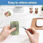 Portable rectangular sensory pick pad held in a hand showing its compact size