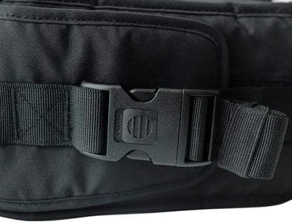 Side profile of the black Tushbaby carrier extender demonstrating how it links into the original hip seat.