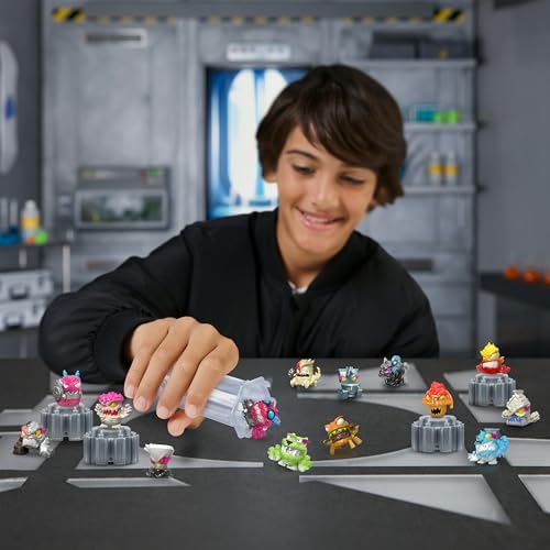 Fourteen miniature collectible micro beasts arranged out of their boxes.