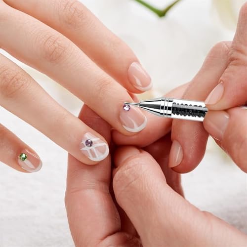 Durable acrylic and metal gemstone applicator tools being used for detailed diamond craft work.