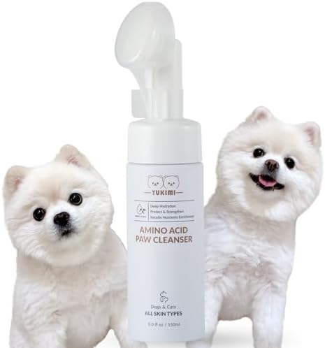 Waterless foaming pet paw cleaner being dispensed onto the soft silicone bristle brush head.
