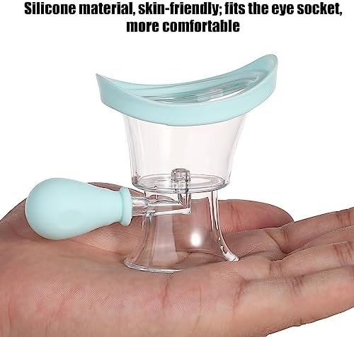 Hand squeezing the manual air pressure bulb of the blue eye wash cup
