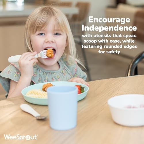 Toddler holding WeeSprout easy-grip silicone utensil