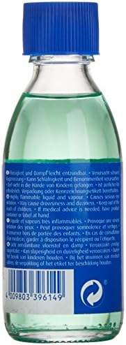 Side angle of the Revell model paint brush cleaning bottle showing safety symbols and product information.