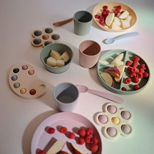 Authentic Mushie chemical-free silicone spoons in elegant Scandinavian pastel tones for baby meals.