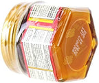 Authentic Tiger Balm Red topical analgesic jar showing instructions and net weight