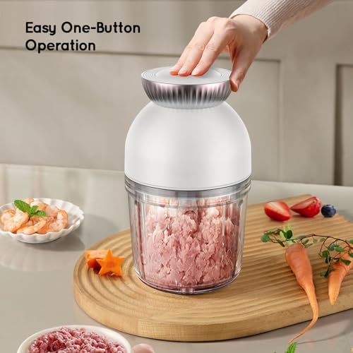 Included silicone spoons and food storage containers filled with colorful fruit purees