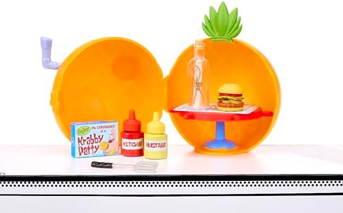 Finished mini food collectible curing under a light source to harden the decorative resin details