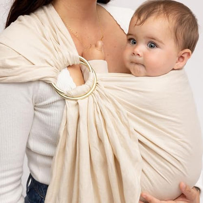 Caregiver demonstrating the hands free mobility achieved using the breathable linen baby sling