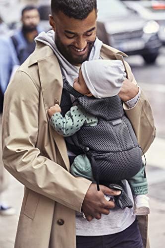 BabyBjorn Anthracite mesh carrier being unfastened to move sleeping infant
