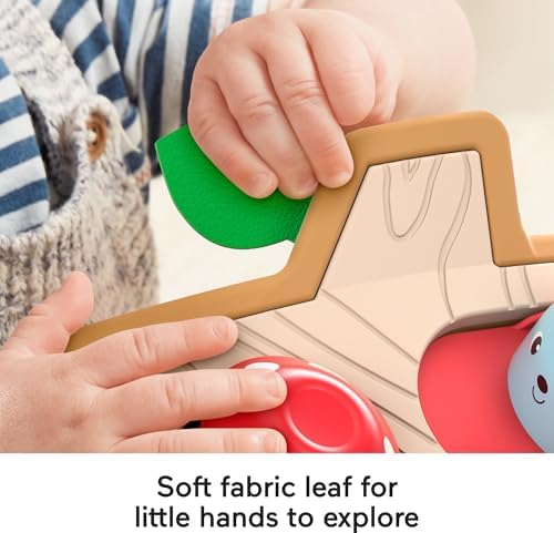 Fisher-Price fine motor skills toy showing a child interacting with the turning and sliding knobs