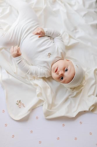 Ely's & Co. newborn essentials pink changing pad cover packaging for baby girls.