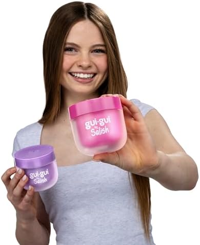 Scented iridescent pink base slime being stretched out of the container