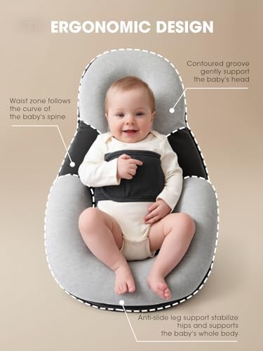 Side profile of Kaatnii tummy time pillow on flat surface