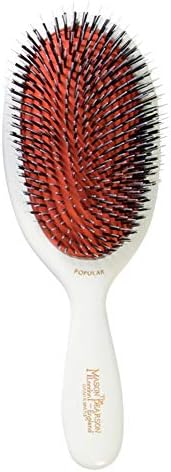 Mason Pearson Popular hairbrush close up view of boar bristles and nylon pins on rubber cushion