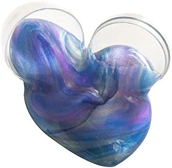 Close up of blue purple and gold swirled galaxy slime out of its egg packaging.