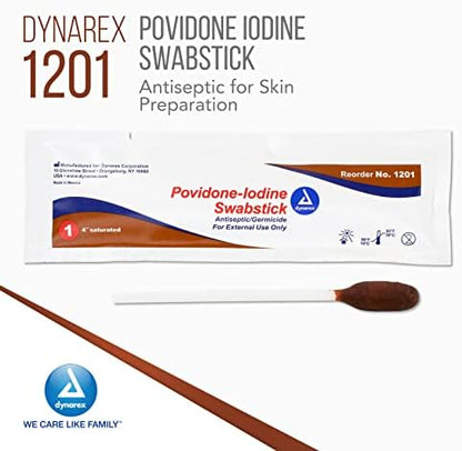 Brown povidone iodine antiseptic stick being removed from foil packaging