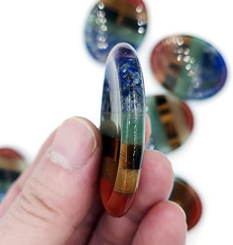 Handheld SHARKOOO worry stone for stress management and mindfulness exercises.
