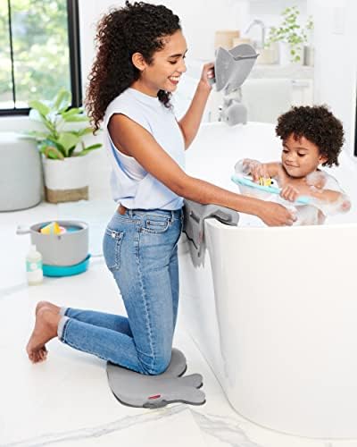 Parent using Skip Hop Moby Waterfall Bath Rinser on baby