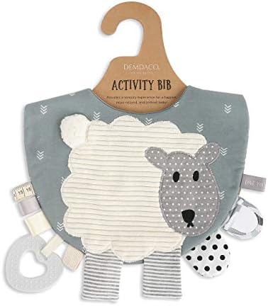 Close up of Demdaco lamb activity bib textured fabric and teething ring
