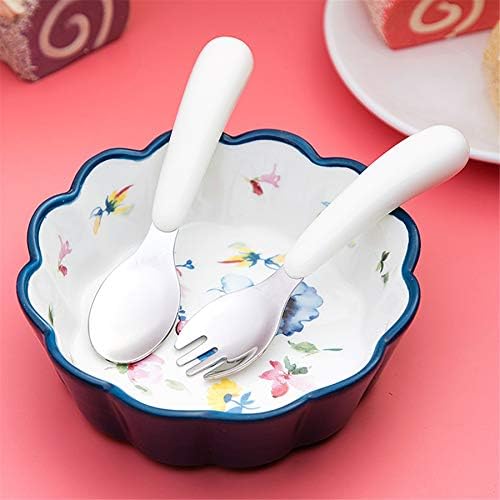 Child using Kirecoo stainless steel spoon for self feeding