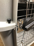 Fasten Tight heavy duty replacement fasteners safely securing the plastic halves of a dog carrier.