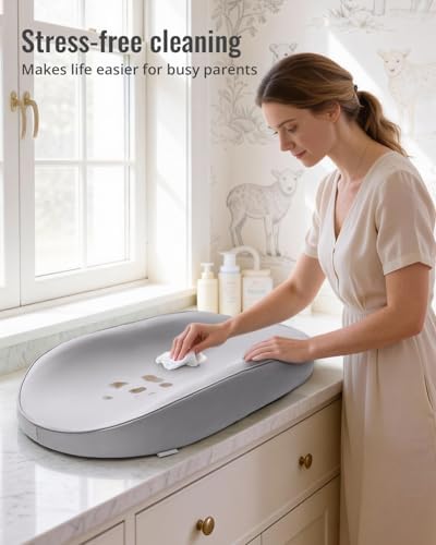 Contoured diaper changing mat showing the supportive memory foam interior cushioning.