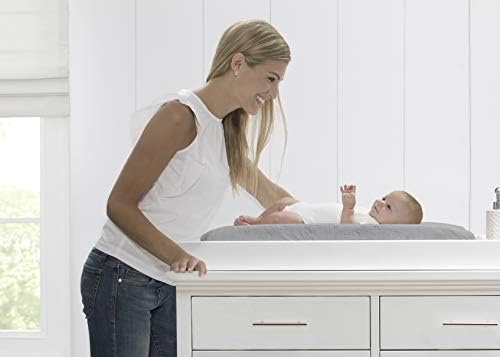 Serta infant changing pad featuring the adjustable safety strap and quick release buckle.