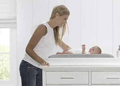 Serta infant changing pad featuring the adjustable safety strap and quick release buckle.