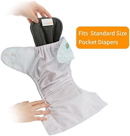 ALVABABY washable cloth diaper inserts being placed inside a standard pocket diaper cover