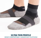 OS1st FS6 black foot sleeve being worn under a standard sock.