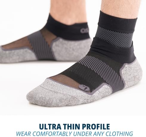 OS1st FS6 black foot sleeve being worn under a standard sock.
