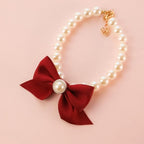 JJLFresheners REBABA pearl pet collar front view showcasing white pearls and red bow jewelry for dogs.