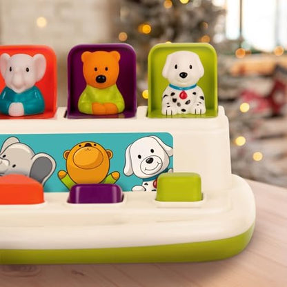 Toddler hands pressing down the orange door on the animal sorting toy