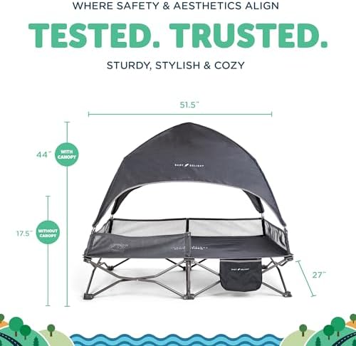 Baby Delight outdoor travel cot with UV blocking canopy set up on a grassy lawn