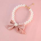 DPWOUM Pearl Dog Necklace front view showing the elegant pink bow pendant.