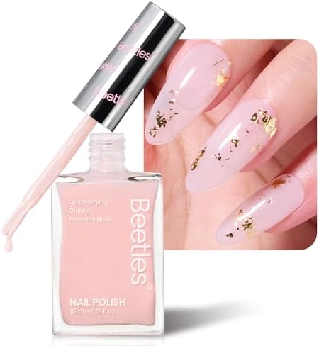 Close up view of the applicator brush applying the light pink jelly nail strengthener onto a natural fingernail.