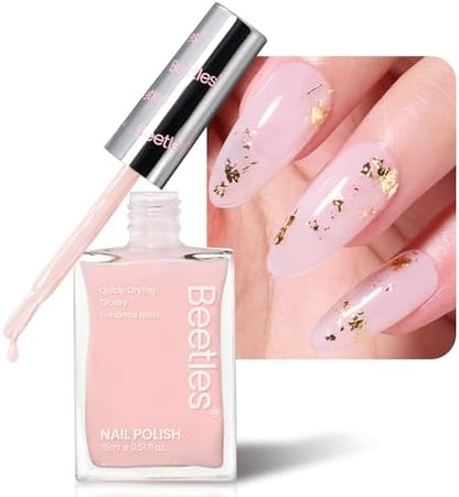 Close up view of the applicator brush applying the light pink jelly nail strengthener onto a natural fingernail.
