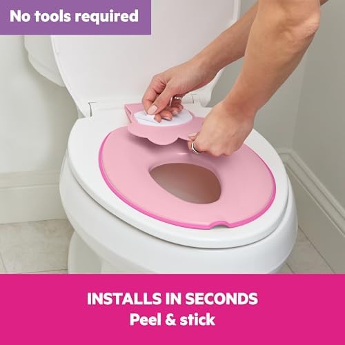 Bright Starts pink toddler potty seat flipped up in space saving position