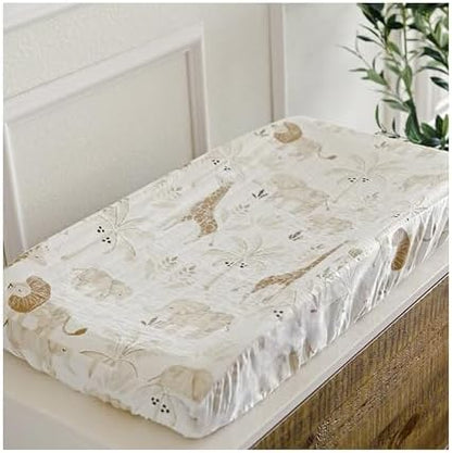 Crane Baby jungle theme quilted changing pad cover showcasing the earthy tones of hand screen printed lions and giraffes.