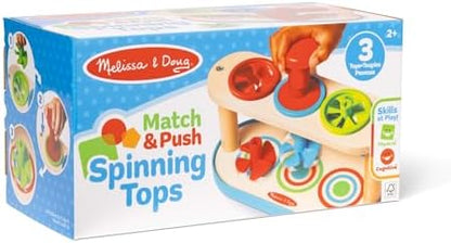 Close up of Melissa and Doug Match and Push Spinning Tops plunger mechanism