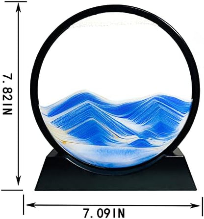 Close up of Sandcle round glass frame with blue and gold sand