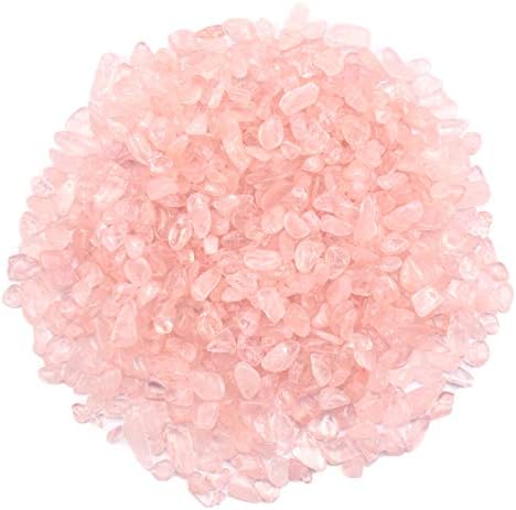 Rose quartz tumbled stone chips inside an aquarium tank