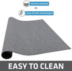 Drymate washable puppy pad hanging up to air dry after cleaning.